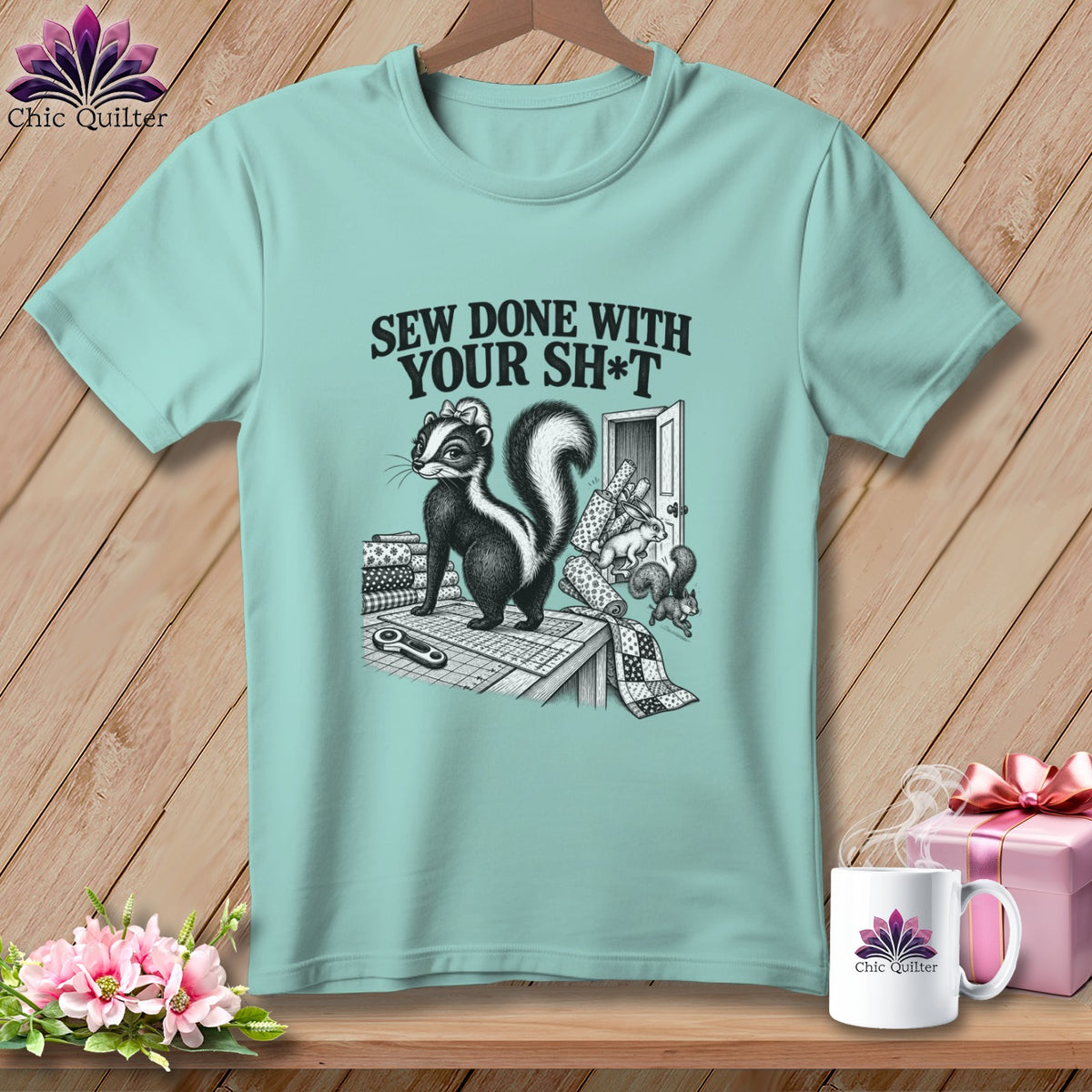 Skunk sewing scene with text "Sew Done With Your Sh*t" and various quilting supplies.