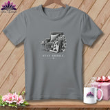 Grey t-shirt with armchair, quilt, and 