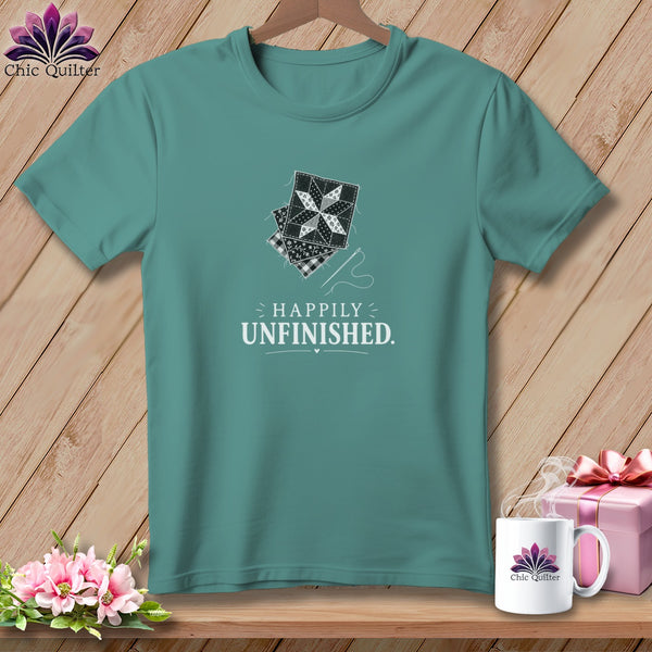 Teal t-shirt with stacked quilt squares and "Happily Unfinished" text.