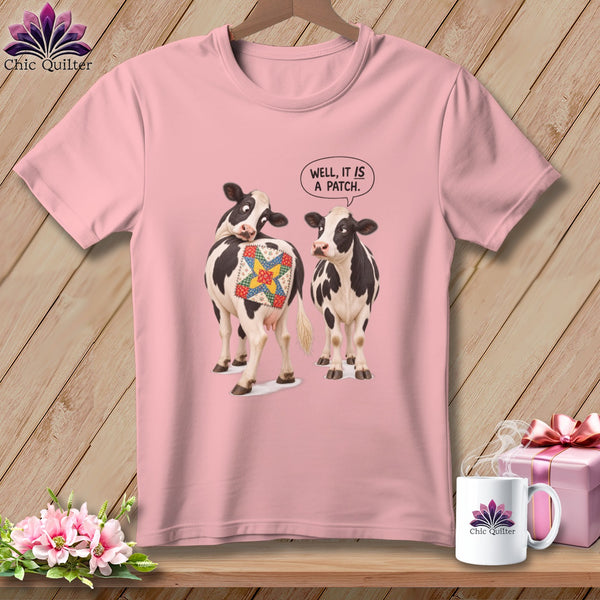 Two cows, one with a quilt patch, and a speech bubble saying "WELL, IT IS A PATCH."