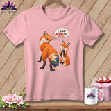 Pink t-shirt with two foxes, one with a quilted tail, and text 