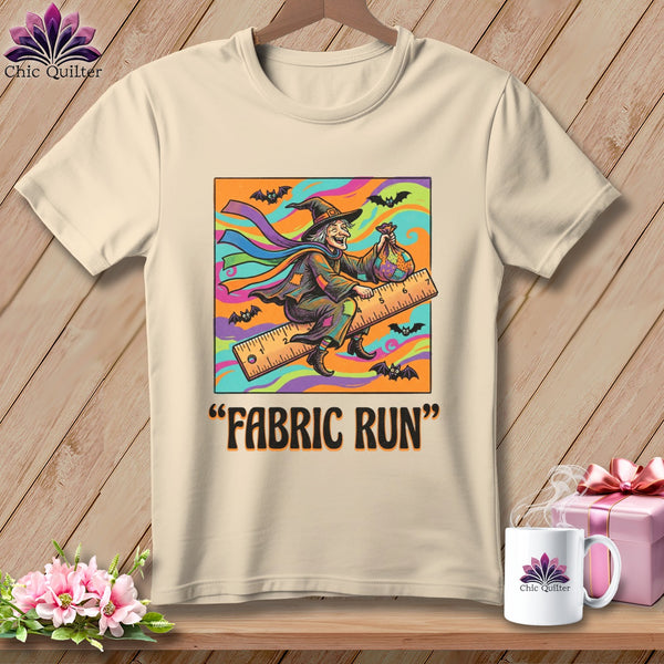 A witch on a ruler with bats and a fabric bag, text "FABRIC RUN".
