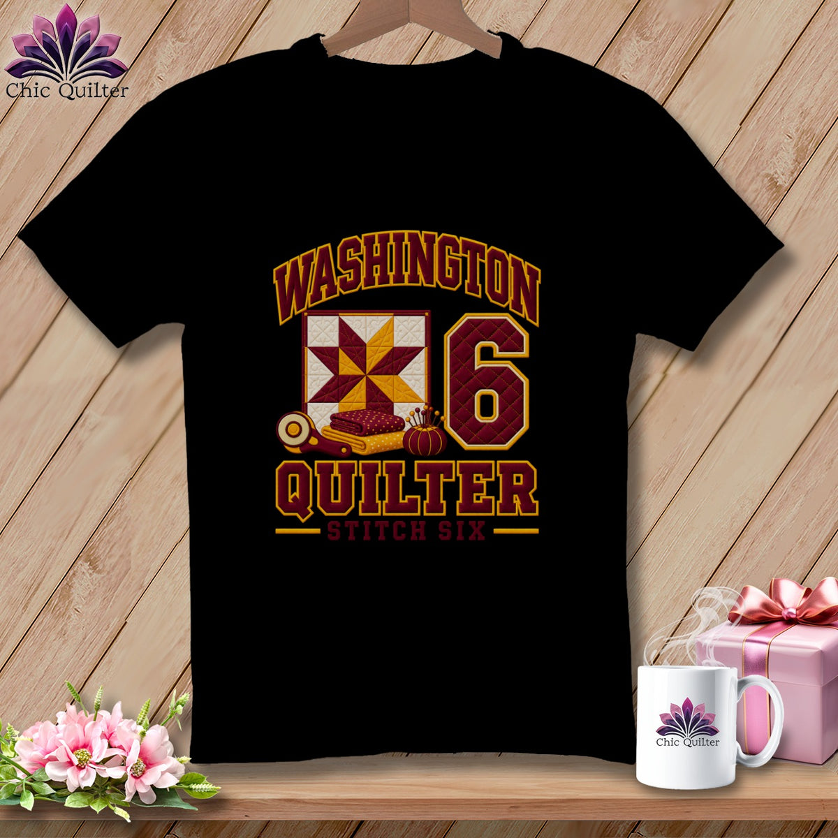 A black t-shirt displays a Washington Quilter Stitch Six graphic with a quilt block and the number six.