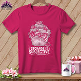 Pink t-shirt with white graphic of overflowing basket of fabric and text 