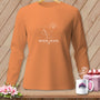 Orange long sleeve shirt with a white line art graphic of a needle, thread, and sunrise.
