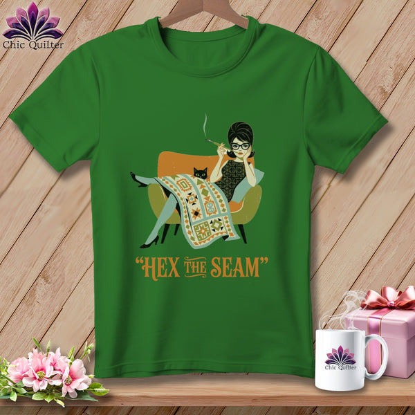 Green t-shirt with retro woman, cat, and text "Hex the Seam".