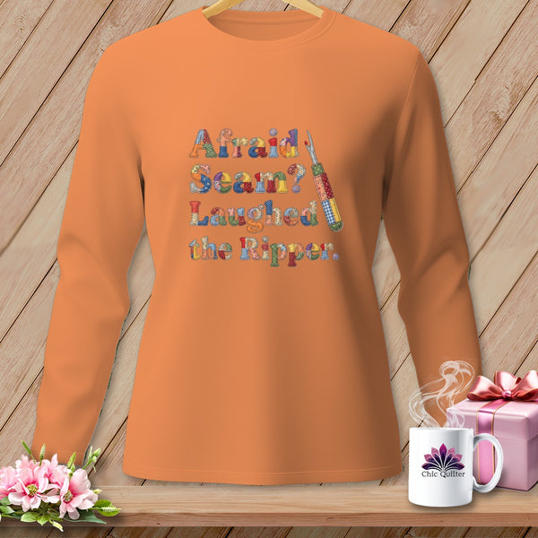Orange long-sleeved shirt with "Afraid Seam? Laughed the Ripper" text.