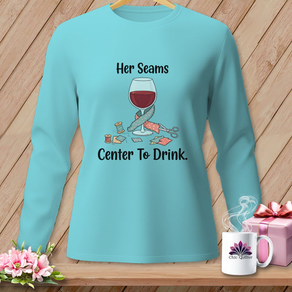 Aqua long-sleeve shirt with "Her Seams Center To Drink" text and sewing graphics.