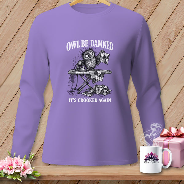 Purple long-sleeve shirt with an owl ironing a quilt. Text says "Owl Be Damned, It's Crooked Again".