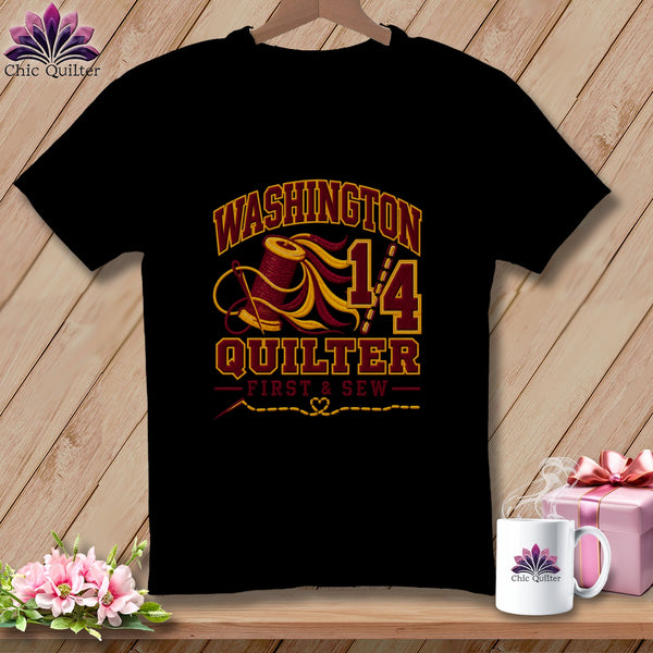 Black t-shirt featuring a Washington Quilter graphic with a spool of thread, needle, and text.