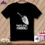 Black t-shirt with scissors cutting fabric, text "THAT'S STILL FABRIC".