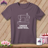Purple t-shirt with white line art sewing machine and text 