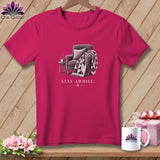 Pink t-shirt with a drawing of a chair, quilt, and mug, text 