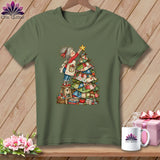 An olive green t-shirt displays a graphic of an elderly woman decorating a patchwork Christmas tree.