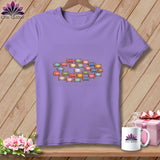Purple crewneck t-shirt featuring a central graphic of colorful spools of thread.