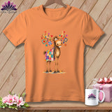 An orange t-shirt displays a cartoon moose with quilt pieces draped on its back and antlers.
