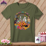 Green t-shirt with Halloween quilting graphic featuring skeleton, mummy, witch, and pumpkins.