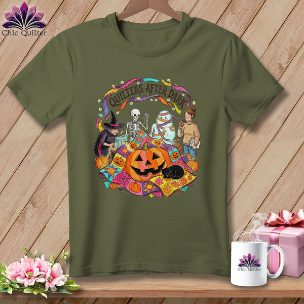 Green t-shirt with Halloween quilting graphic featuring skeleton, mummy, witch, and pumpkins.