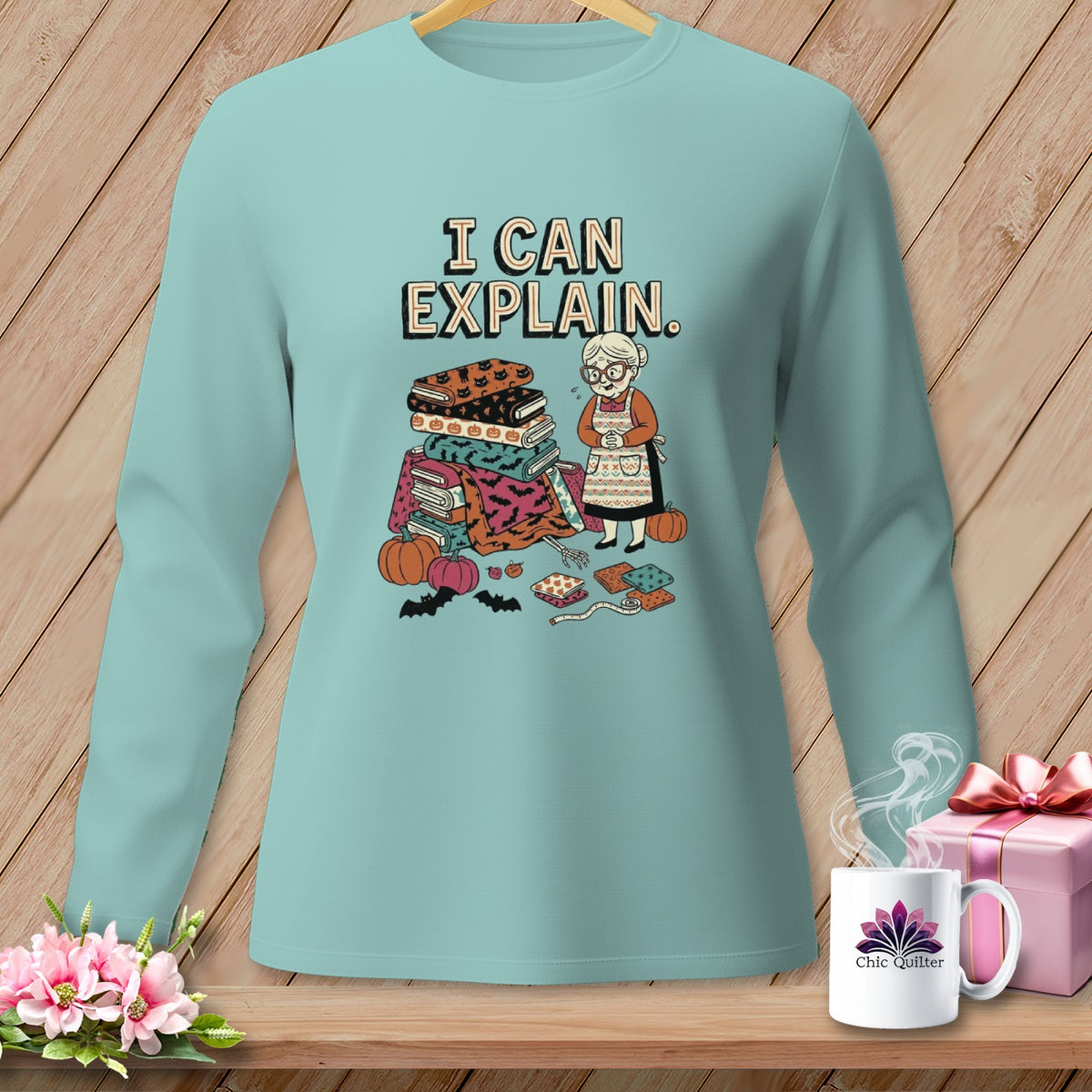 Mint long-sleeve shirt with "I CAN EXPLAIN" and Halloween quilting theme graphic.