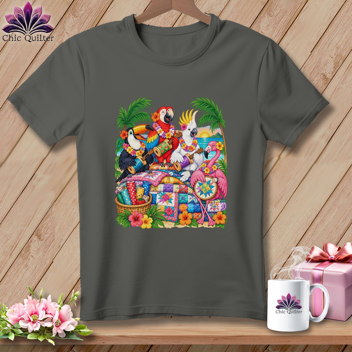 A dark gray t-shirt featuring a colorful graphic of tropical birds playing ukuleles over quilts.