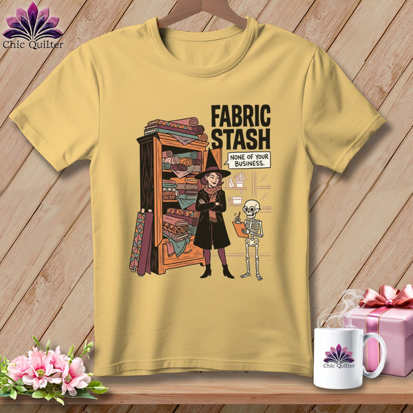 Yellow t-shirt with "Fabric Stash None of Your Business" graphic featuring a witch and a skeleton.