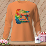 An orange long-sleeve shirt on a hanger displays a colorful, intricate sewing machine graphic.