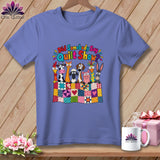 Periwinkle t-shirt printed with cartoon farm animals behind a colorful patchwork quilt and text reading Did Somebody Say Quilt Show.