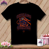 Black t-shirt featuring a Chicago Quilter graphic of a bear holding a spool of thread.