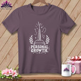T-shirt with white graphic of thimble, needle, and thread, text 