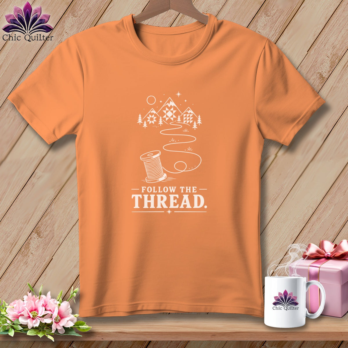 Orange t-shirt with "Follow The Thread" text and spool graphic.