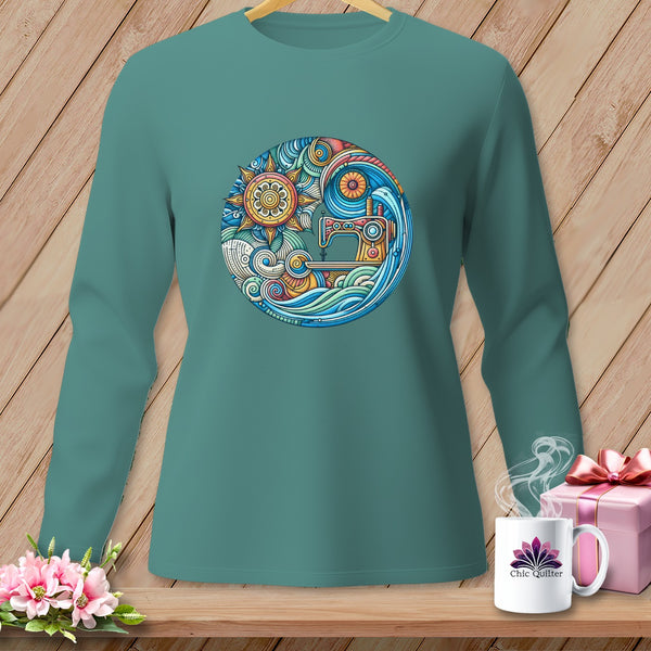 Teal long-sleeve shirt featuring a circular graphic of a sewing machine and sun.