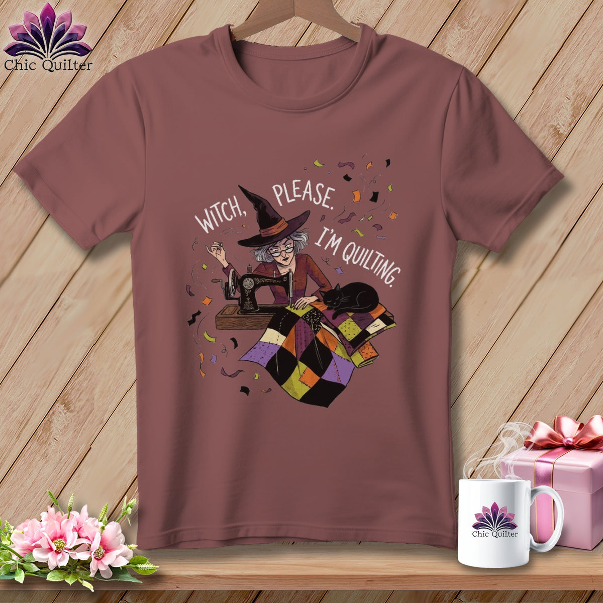 Witch please, I'm quilting graphic on a mauve t-shirt with a sewing machine and quilt.