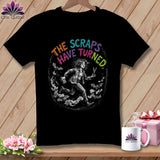 Black t-shirt with illustration of woman running with scissors and bats, text 