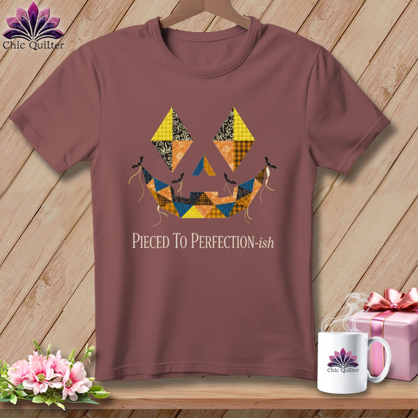 T-shirt with a quilted jack-o'-lantern face and "Pieced To Perfection-ish" text.