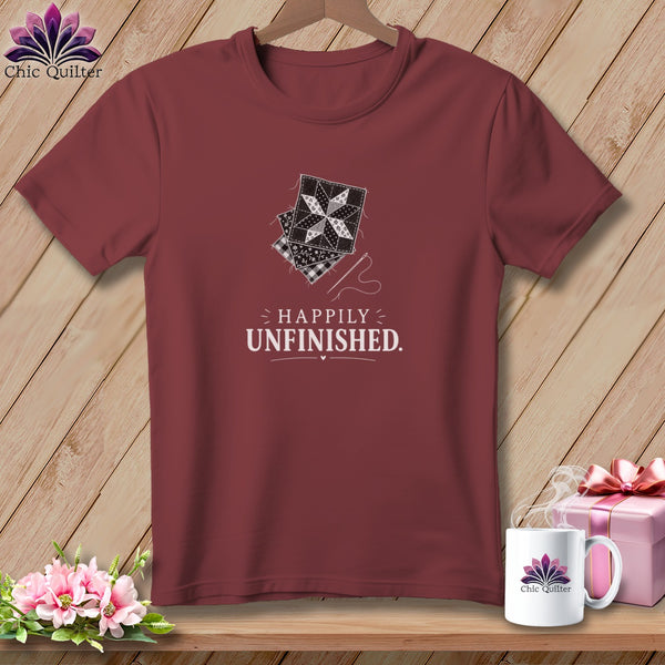 Maroon t-shirt with quilting blocks, needle, thread, and "Happily Unfinished" text.
