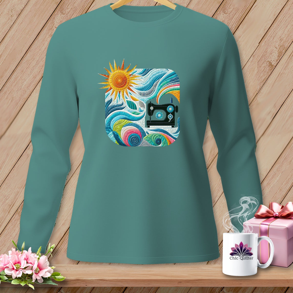 Teal long-sleeve shirt with a colorful sewing graphic and "Chic Quilter" mug.