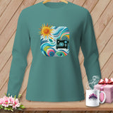 Teal long-sleeve shirt with a colorful sewing graphic and 