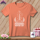 Coral t-shirt with white graphic of seam ripper and text 