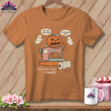 Halloween pumpkin sewing on a machine with ghosts, reads 