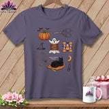 T-shirt with Halloween sewing motifs: pumpkin, ghost, cat, needlework tools, and candy corn.