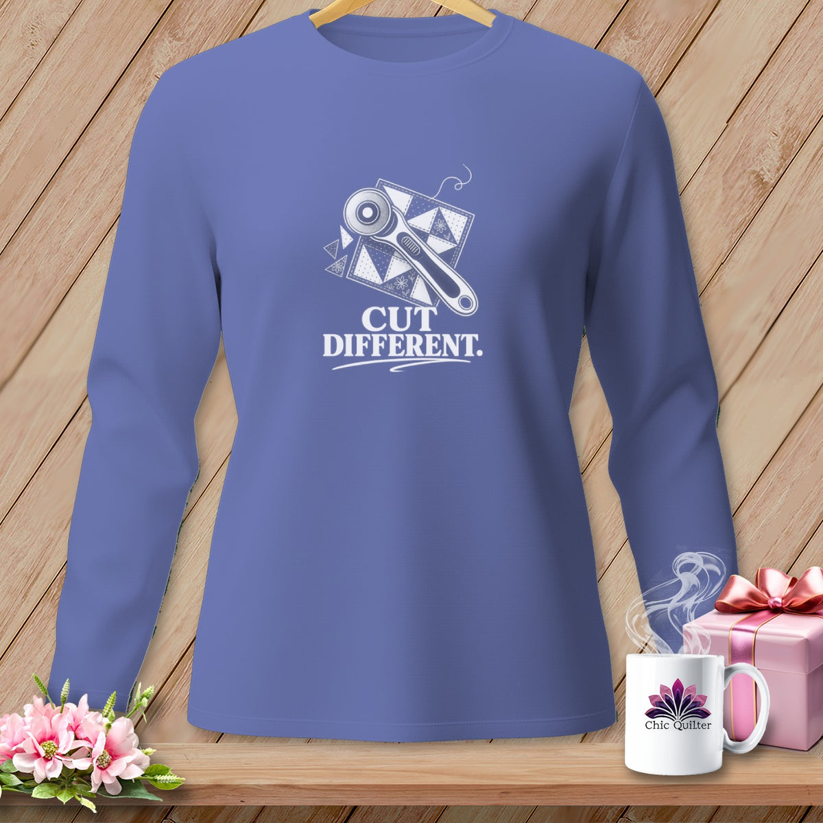 Long-sleeved purple t-shirt with rotary cutter and "CUT DIFFERENT" graphic.
