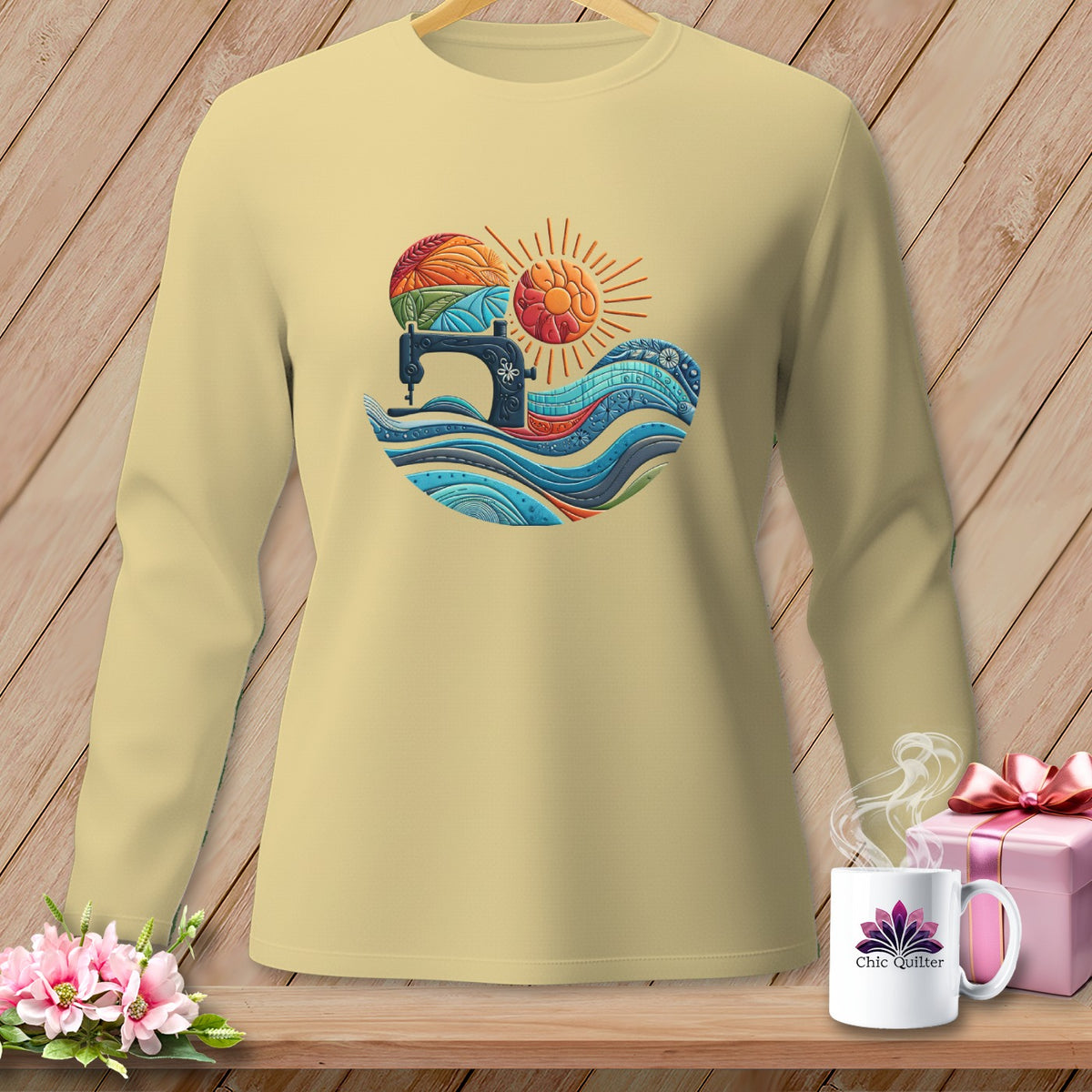 Light yellow long-sleeve shirt with a colorful sewing machine and sun graphic.