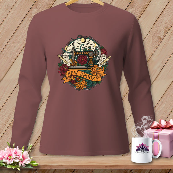 Brown long-sleeve shirt with a circular Halloween sewing graphic that says "SEW SPOOKY".