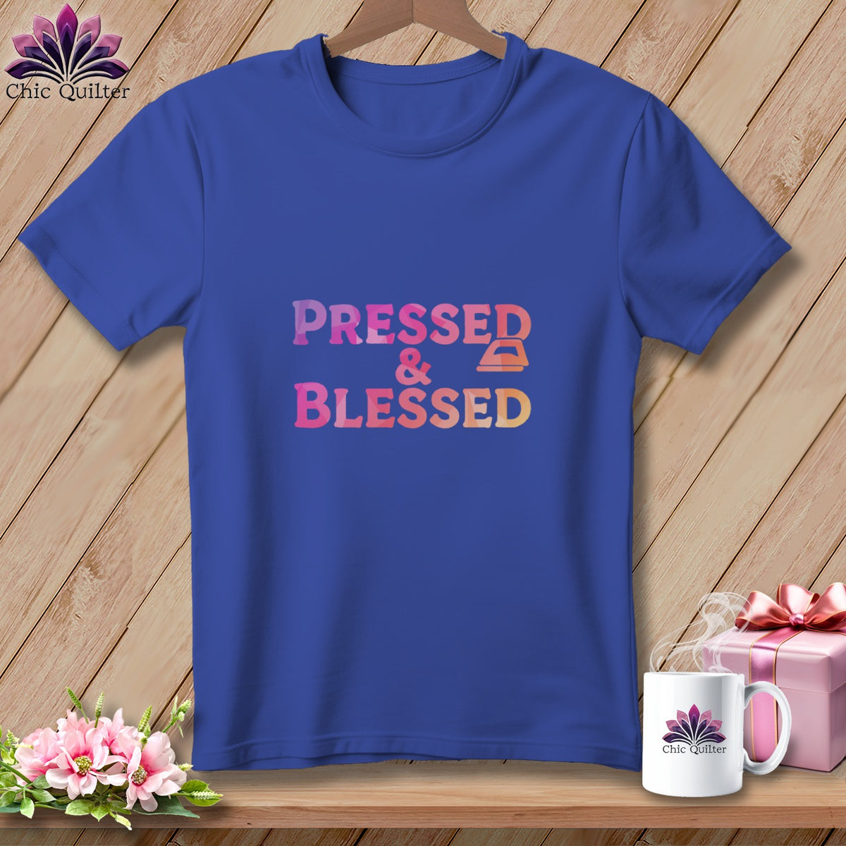Blue t-shirt with "Pressed & Blessed" text and an iron icon.