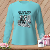 Teal long-sleeve shirt with skunk sewing graphic and 