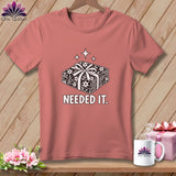 Pink t-shirt with a graphic of stacked fabric rolls tied with a bow.
