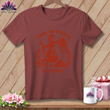 Maroon t-shirt with orange graphic of a woman with scissors and fabric, saying 