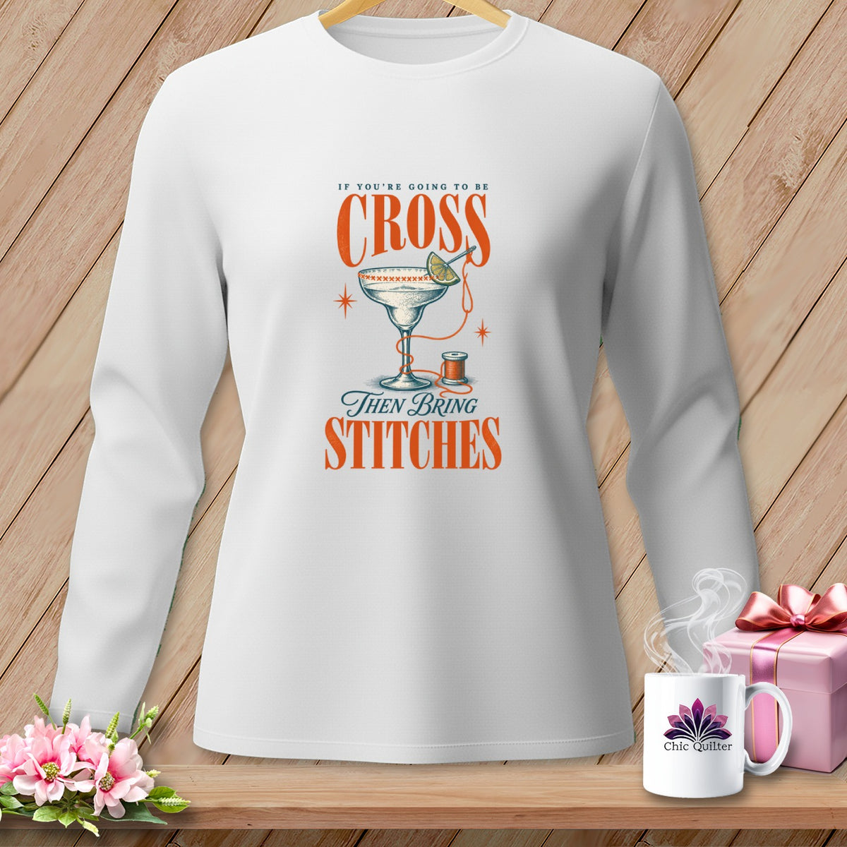 White long-sleeve shirt with graphic text "If you're going to be cross then bring stitches"