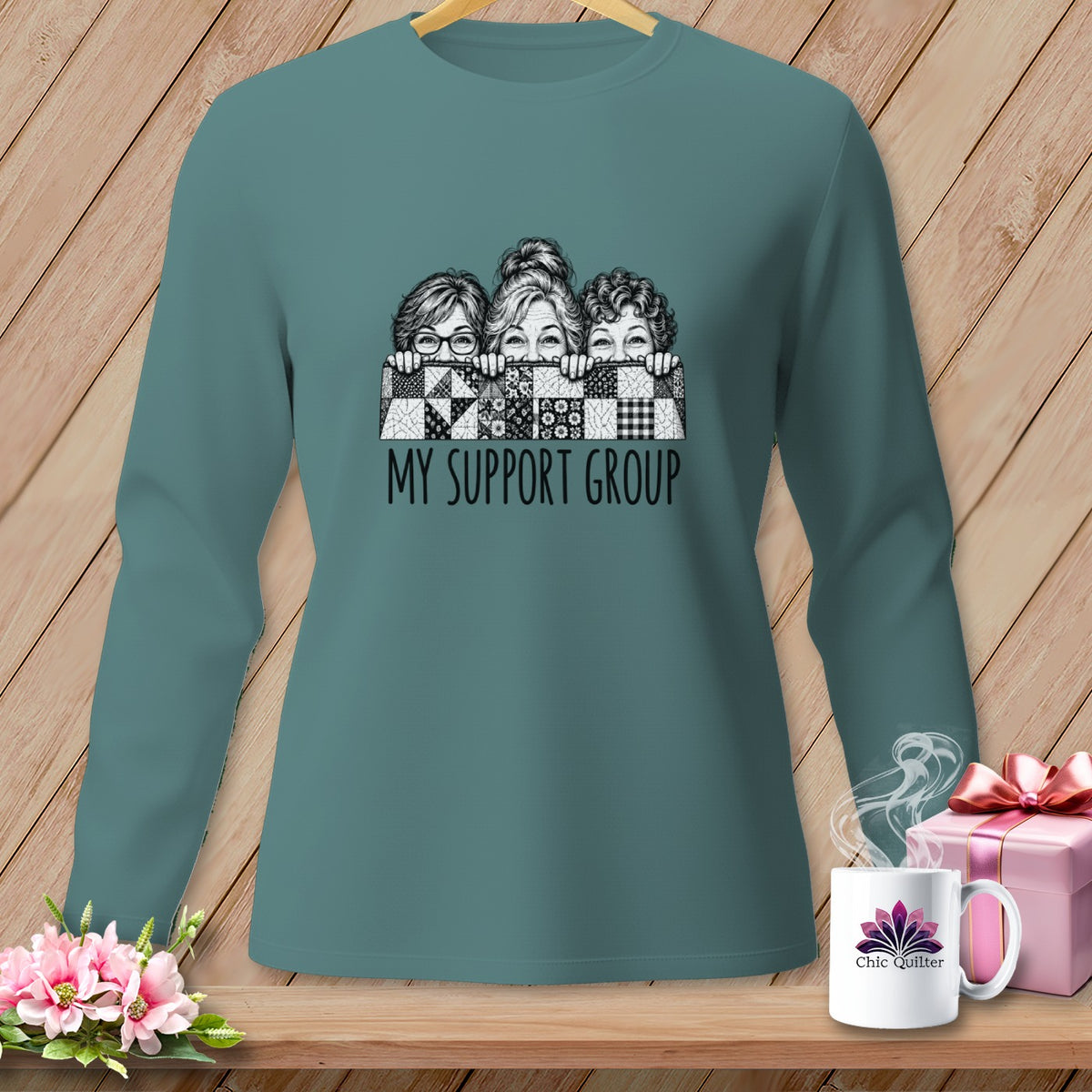 Teal long-sleeve shirt with three women peeking over a quilt, text "MY SUPPORT GROUP".