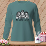 Teal long-sleeve shirt with three women peeking over a quilt, text 